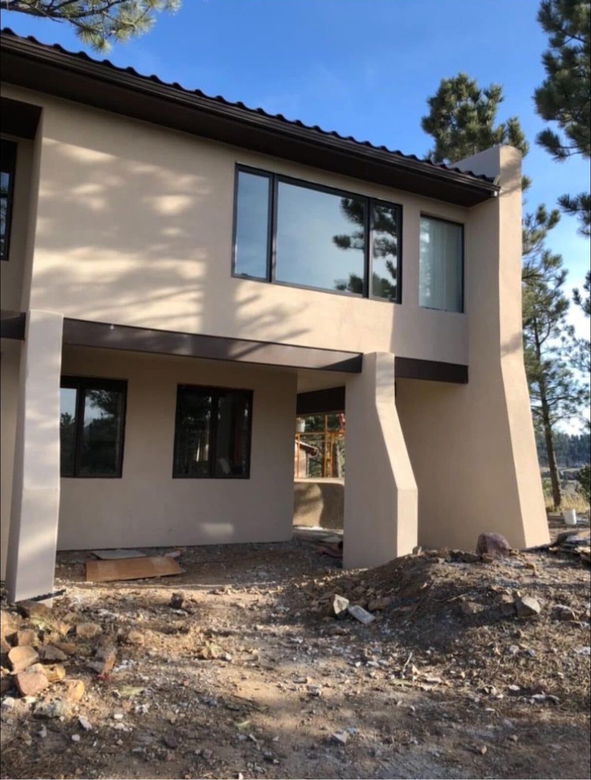 A Colorado foothills home finished in warm sand-coloured stucco by HJ Stucco